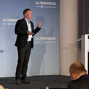 Titus Aust on Stage of Automotive Software Strategies Conference