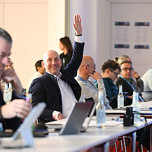A view of the plenary session—many people are speaking up