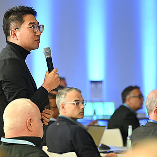 A participant who asks the speaker a technical question
